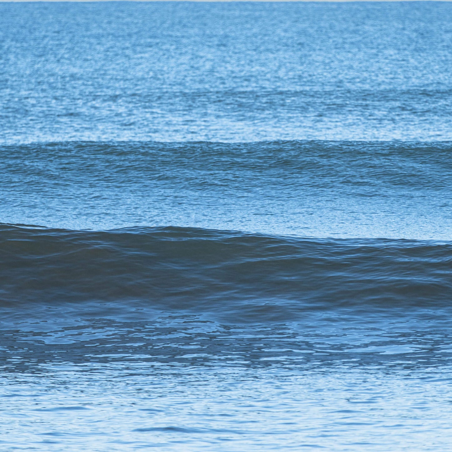 Closeup of Waves crashing onto a shore.
