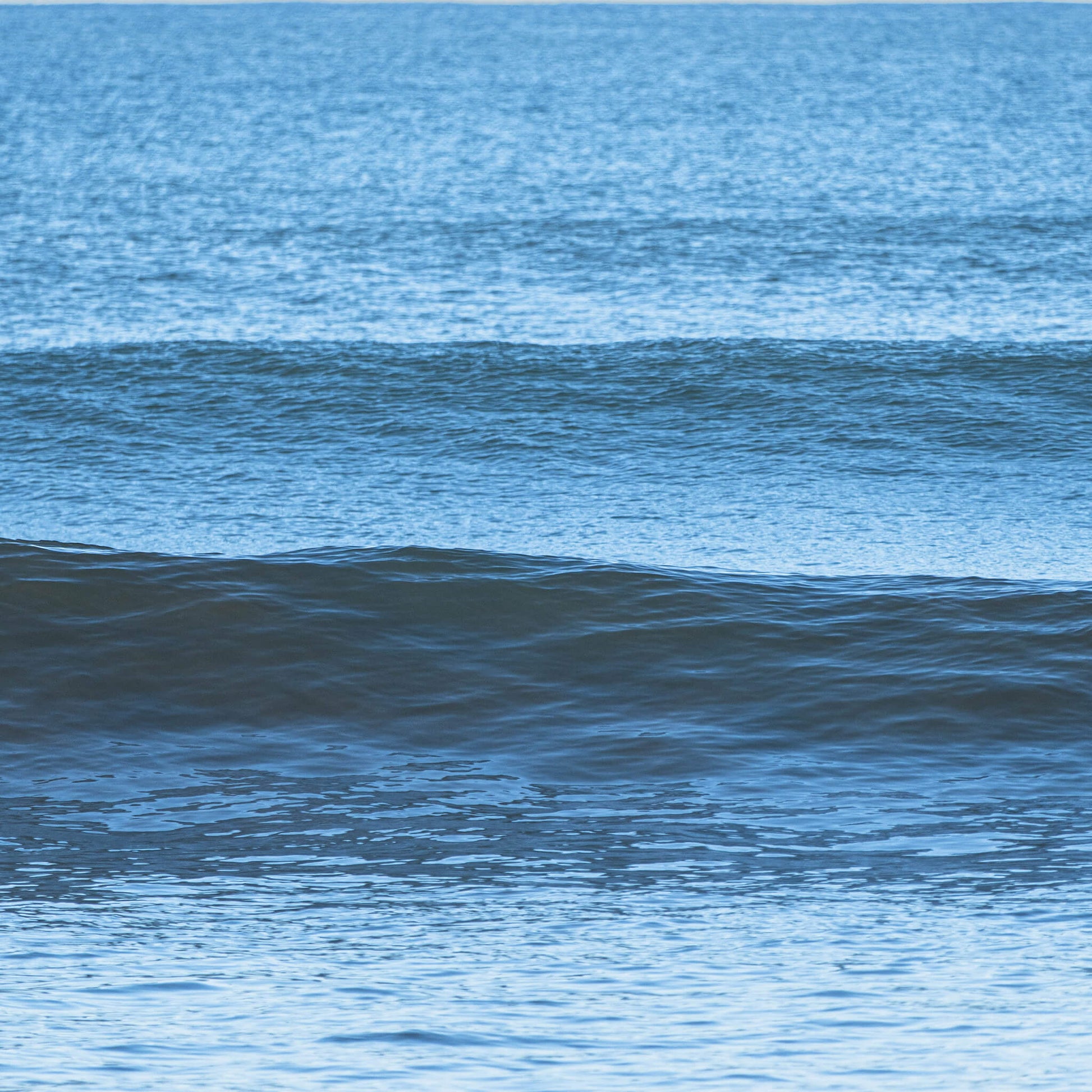 Closeup of Waves crashing onto a shore.